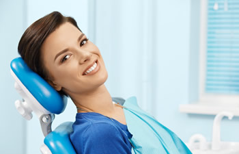 Smiling girl in the dental chair